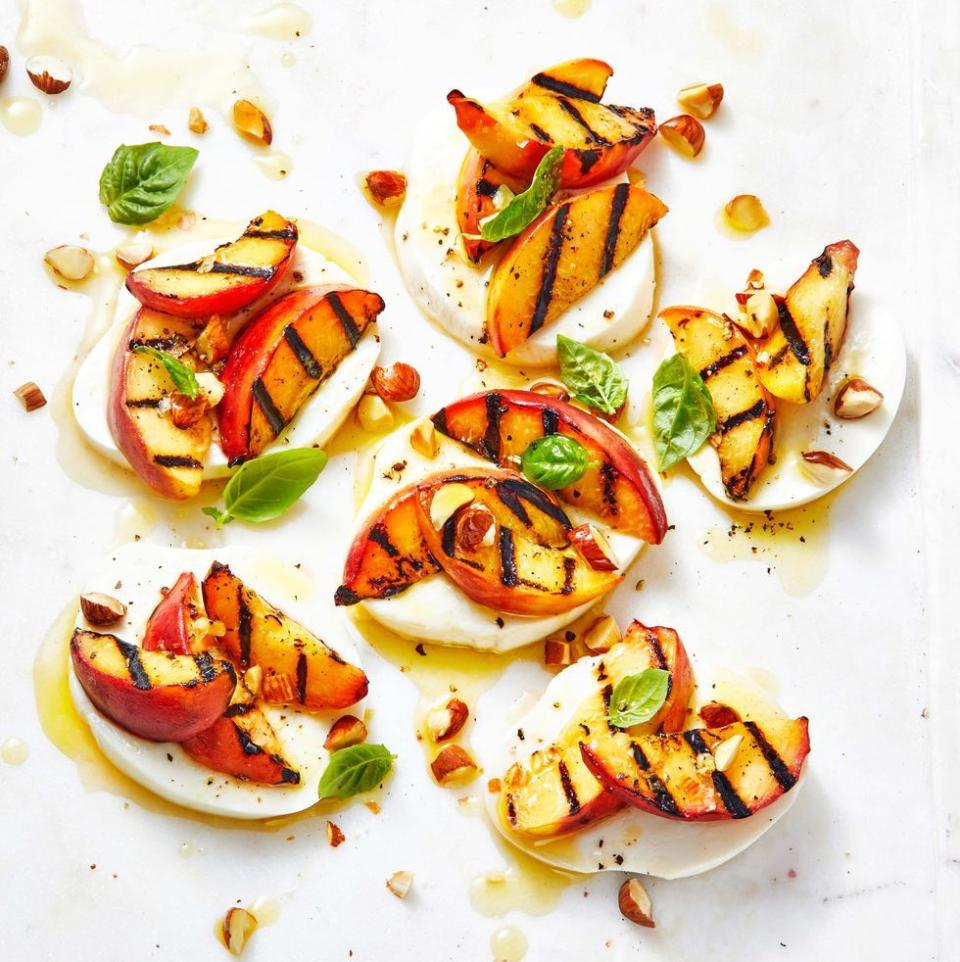 <p>This sweet and salty salad pairs peaches with honey, almonds, mozzarella and fresh basil. What more could you ask for? </p><p>Get the <strong><a href="https://www.goodhousekeeping.com/food-recipes/a36787699/peach-caprese-salad-recipe/" rel="nofollow noopener" target="_blank" data-ylk="slk:Peach Caprese Salad recipe;elm:context_link;itc:0;sec:content-canvas" class="link ">Peach Caprese Salad recipe</a></strong>. </p>