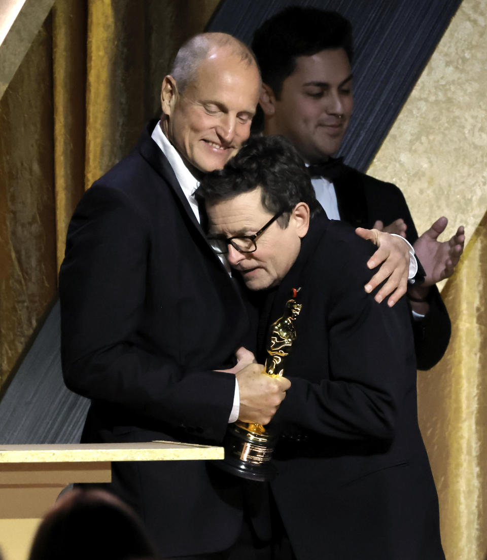 Woody Harrelson congratulates Michael J. Fox during the Academy of Motion Picture Arts and Sciences 13th Governors Awards at Fairmont Century Plaza on November 19, 2022 in Los Angeles. / Credit: Getty Images