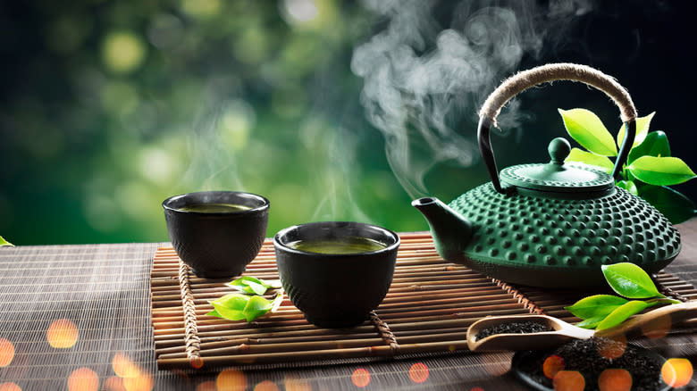 Green Japanese teapot with cups