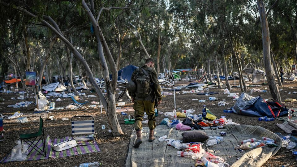 An Israeli soldier patrols near the Nova music festival in southern Israel, where more than 260 bodies were found after Hamas' terror attack. - Aris Messinis/AFP/Getty Images