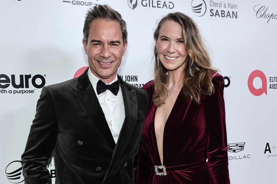 <p>Jamie McCarthy/Getty</p> Eric McCormack and Janet Holden at the Elton John AIDS Foundation