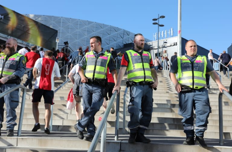 Security guards stand in front of the stadium prior to the UEFA Europa League final football match Ajax Amsterdam v Manchester United on May 24, 2017 in Solna near Stockholm