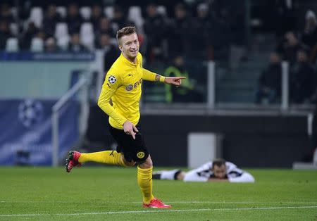 Borussia Dortmund's Marco Reus celebrates after scoring against Juventus during their Champions League round of 16 first leg soccer match at the Juventus stadium in Turin February 24, 2015. REUTERS/Giorgio Perottino