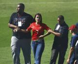 Security guards stop a fan from running towards Portugal's Cristiano Ronaldo during the team training session in Campinas, June 12, 2014. Portugal is preparing for their first soccer match of the 2014 World Cup against Germany on June 16. REUTERS/Mauro Horital