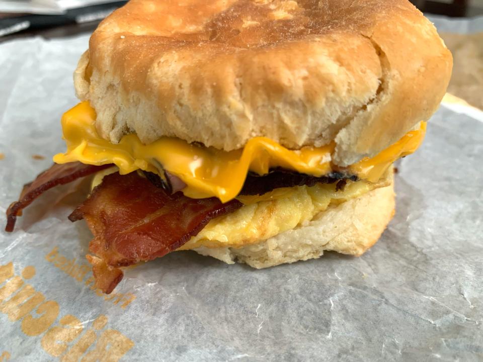 Burger King bacon, sausage, egg, and cheese biscuit on white wrapper