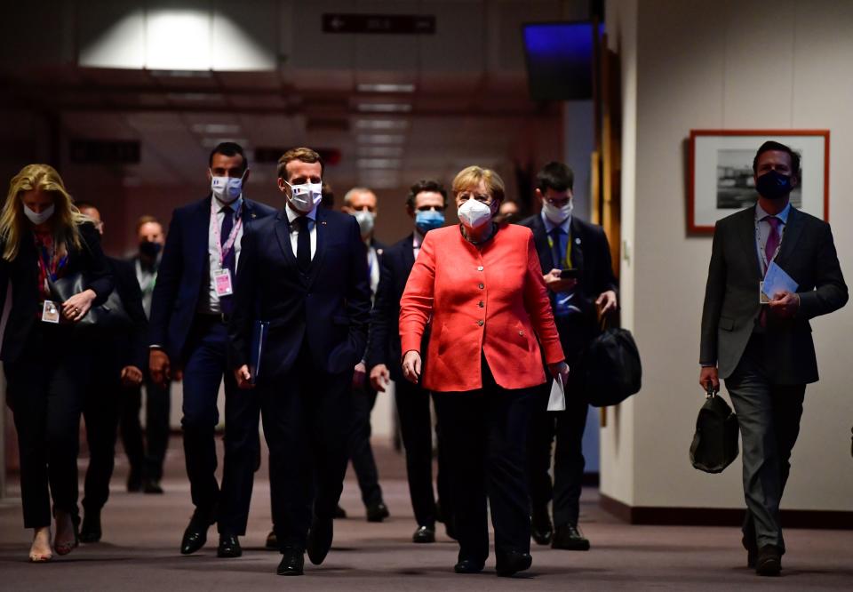 German chancellor Angela Merkel, right, and French president Emmanuel Macron at the EU headquarters in Brussels. Photo: John Thys/AFP via Getty Images