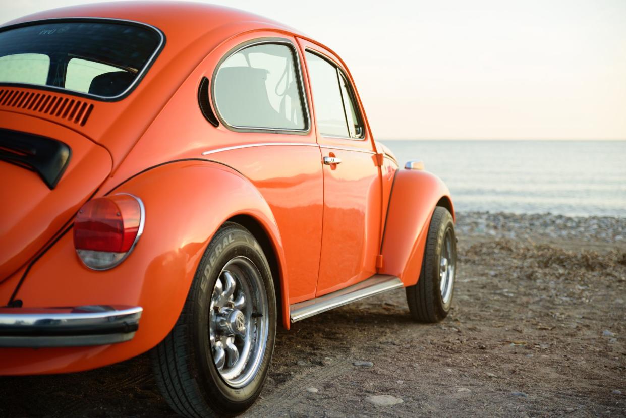 Izmir, Turkey - October 21, 2017 :Classic orange wolkswagen beetle, photo taken in a sea coast of Izmir city, Turkey. No people around.