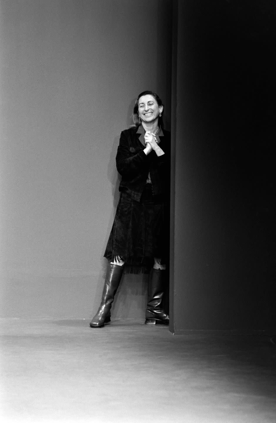 miuccia prada taking her bow at prada fall 1999 runway show