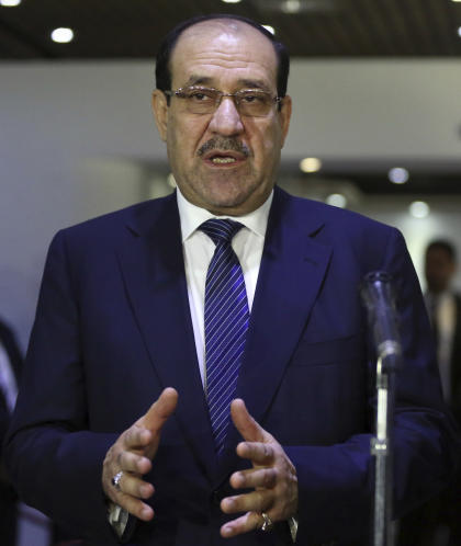 Iraqi Prime Minister Nouri al-Maliki, left, speaks during a press conference with the Sunni Speaker of Parliament Salim al-Jubouri, in Baghdad, Iraq, Saturday, July 26, 2014. Gunmen traveling in black SUVs seized Riyadh al-Adhdah, a senior Sunni politician who had previously been jailed on terrorism charges, from his home in Baghdad on Saturday, police officers said. Al-Maliki discussed al-Adhdah's disappearance with al-Jubouri at a meeting Saturday. The incident comes at a time of mounting sectarian tensions, with Sunni militants having seized vast swaths of northern and western Iraq and Shiite militias having mobilized to help the beleaguered armed forces fight back. (Hadi Mizban/AP Photo)