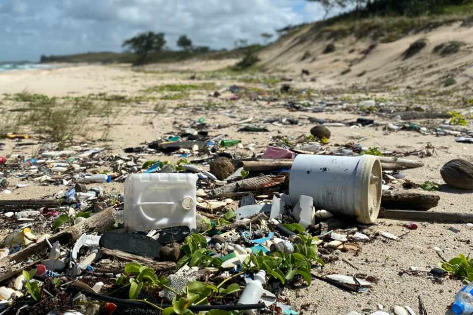 Scattered plastic bits and other rubbish on the sand in Arnhem Land. 