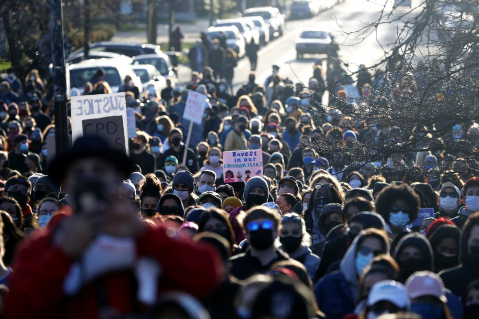 Demonstrators protest the shooting of 13-year-old Adam Toledo, Friday, April 16, 2021, in Logan Park in Chicago. (AP Photo/Shafkat Anowar)