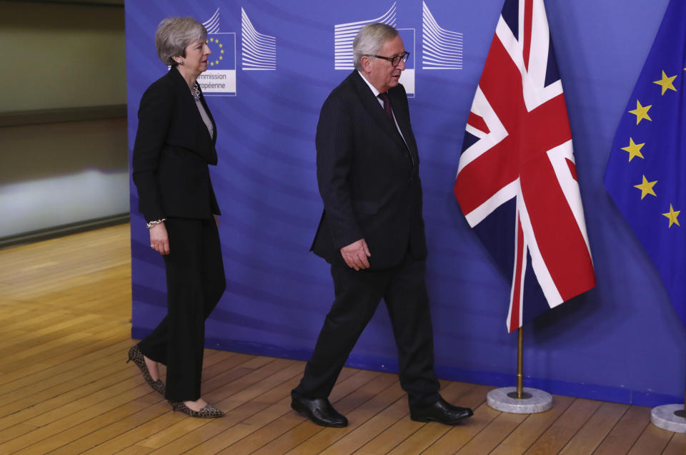 British Prime Minister Theresa May, left, walks with European Commission President Jean-Claude Juncker prior to a meeting at EU headquarters in Brussels, Wednesday, Feb. 20, 2019. European Commission President Jean-Claude Juncker and British Prime Minister Theresa May meet Wednesday for their latest negotiating session to seek an elusive breakthrough in Brexit negotiations. (AP Photo/Francisco Seco)