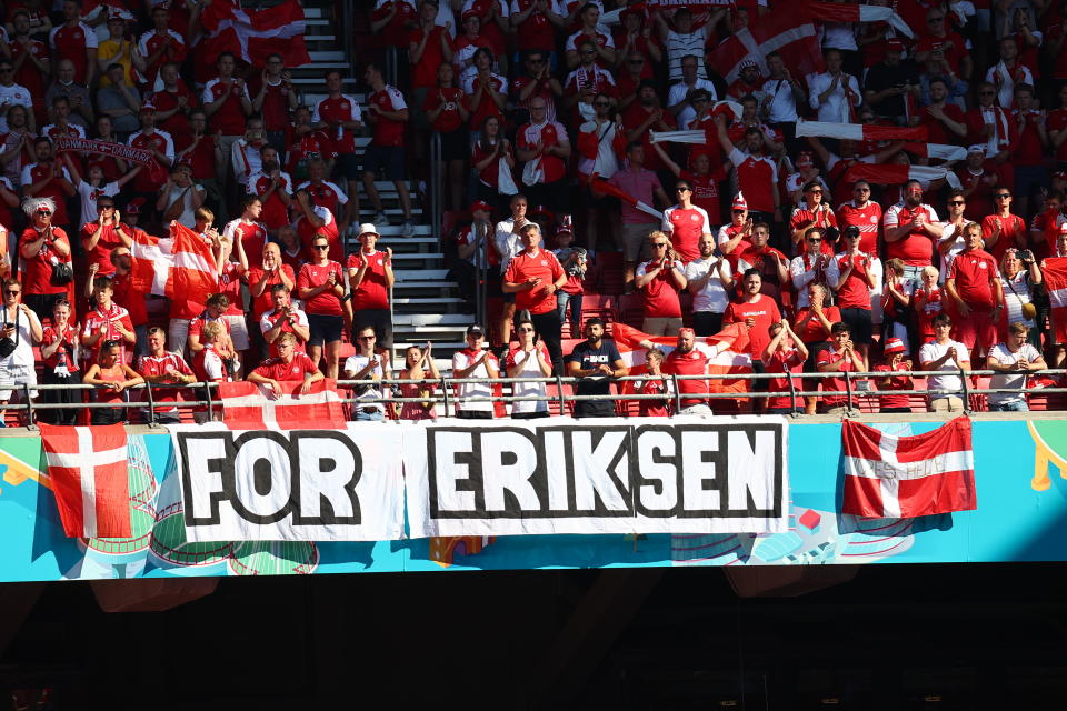 Denmark supporters display a banner for Christian Eriksen, the Danish player who collapsed during the match against Finland last Saturday, June 12, prior to the Euro 2020 soccer championship group B match between Denmark and Belgium, at the Parken stadium in Copenhagen, Thursday, June 17, 2021. (Wolfgang Rattay, Pool via AP)