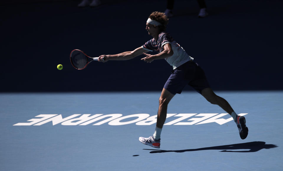 Germany's Alexander Zverev makes a forehand return to Switzerland's Stan Wawrinka during their quarterfinal match at the Australian Open tennis championship in Melbourne, Australia, Wednesday, Jan. 29, 2020. (AP Photo/Andy Wong)