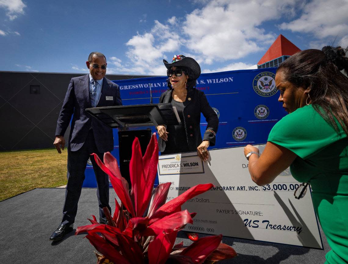 Congresswoman Frederica Wilson, center, presents a $3 Million check to Board Chairman Dr. Rudolph Moise, left, during a press conference on Wednesday, April 24, 2024, at the Museum of Contemporary Art in North Miami. The museum intends on using the money to create more gallery space inside the building and renovate some of the existing spaces.