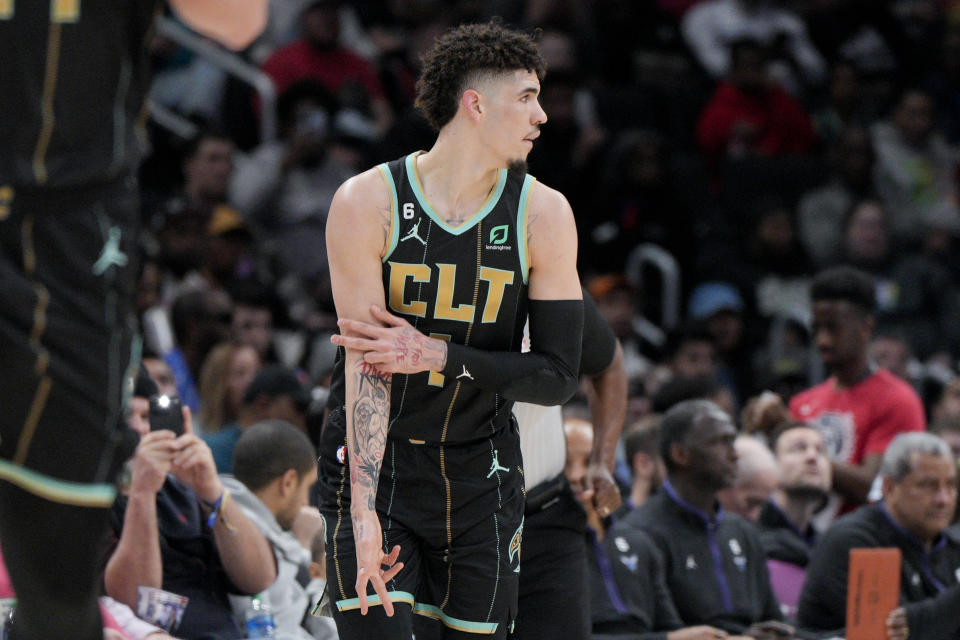 Charlotte Hornets guard LaMelo Ball (1) reacts after scoring against the Washington Wizards during the first half of an NBA basketball game Wednesday, Feb. 8, 2023, in Washington. (AP Photo/Jess Rapfogel)