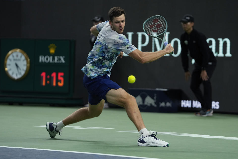 Hubert Hurkacz of Poland returns a shot to Fabian Marozsan of Hungary during the men's singles quarterfinal match of the Shanghai Masters tennis tournament at Qizhong Forest Sports City Tennis Center in Shanghai, China, Thursday, Oct. 12, 2023. (AP Photo/Andy Wong)