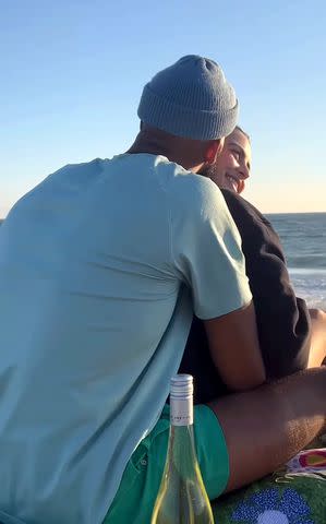 <p>Matt James/Instagram</p> Matt James embracing girlfriend Rachael Kirkconnell with an ocean view