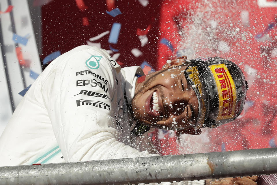 Mercedes driver Lewis Hamilton, of Britain, celebrates following the Formula One U.S. Grand Prix auto race at the Circuit of the Americas, Sunday, Nov. 3, 2019, in Austin, Texas. (AP Photo/Eric Gay)