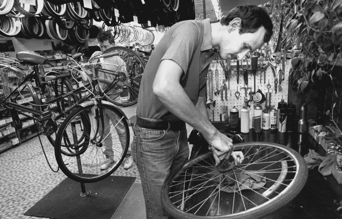 Alan Keimig overhauls a three-speed bicycle hub at Tom Sawyers bicycle shop in 1991. The 60-year-old Tom Sawyer Bicycle Shop in south Wichita will close its door soon. File/The Wichita Eagle