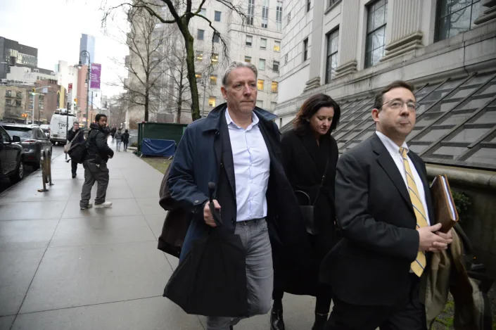 Charles McGonigal, left, leaves Federal District Court in Manhattan, Monday, Jan. 23, 2023. (Jefferson Siege/The New York Times)