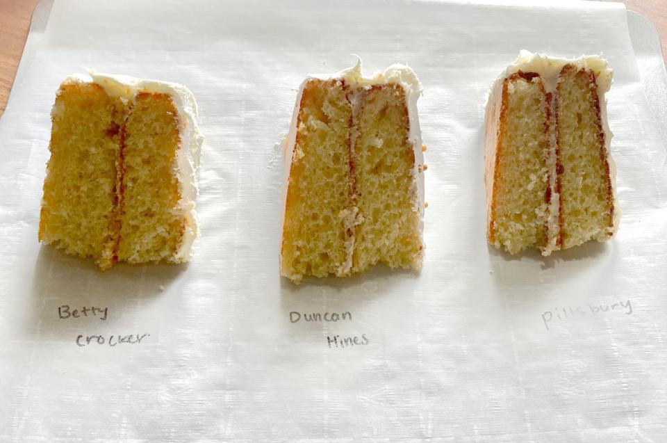 three vanilla cake slices on a piece of white parchment paper