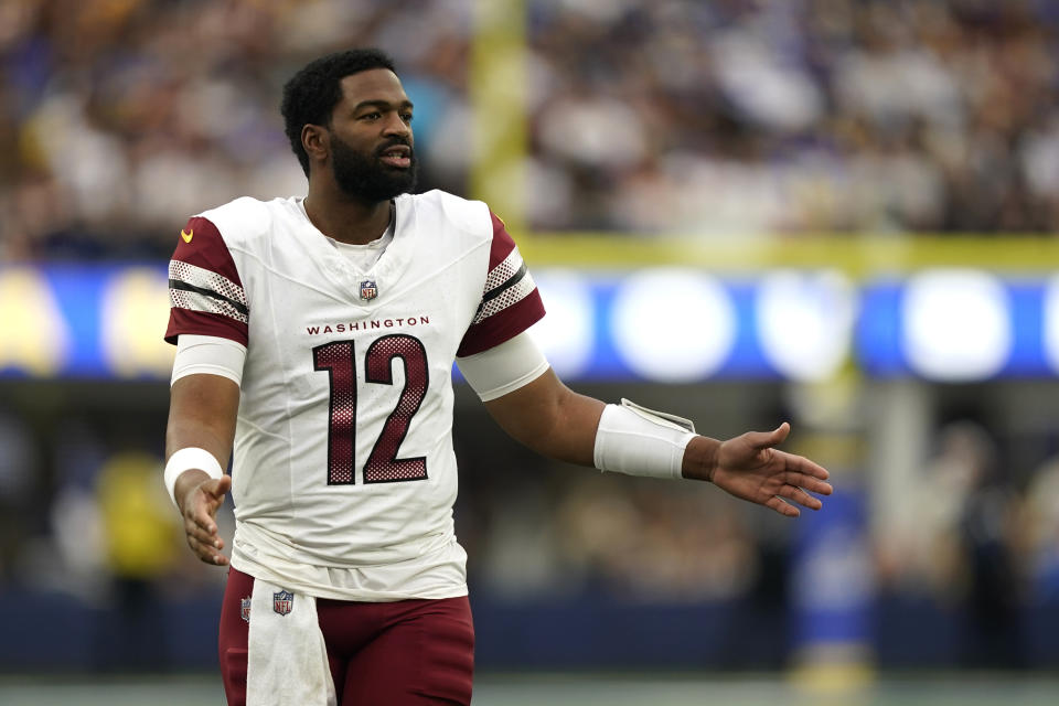 Washington Commanders quarterback Jacoby Brissett (12) gestures during the first half of an NFL football game against the Los Angeles Rams Sunday, Dec. 17, 2023, in Los Angeles. (AP Photo/Ryan Sun)