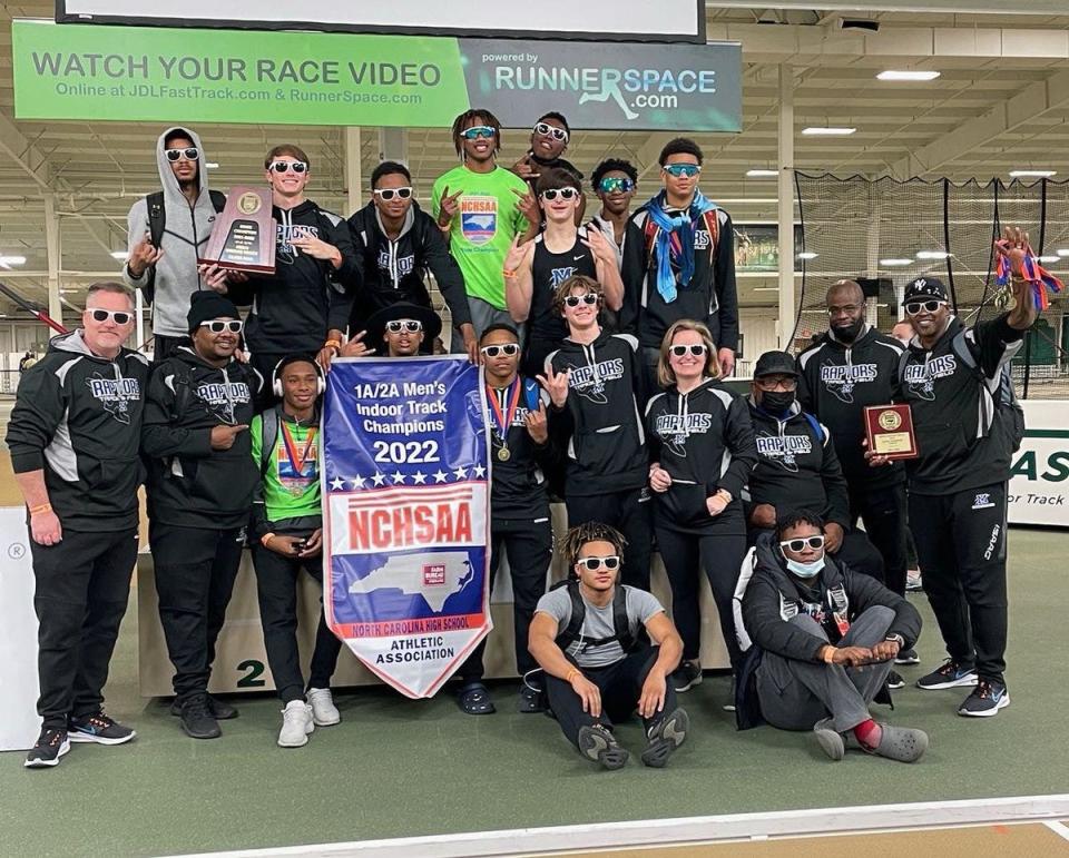 The Mountain Island Charter indoor track and field team celebrates its state championship won Feb. 11, 2022.