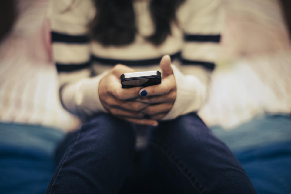 A woman texting on her phone