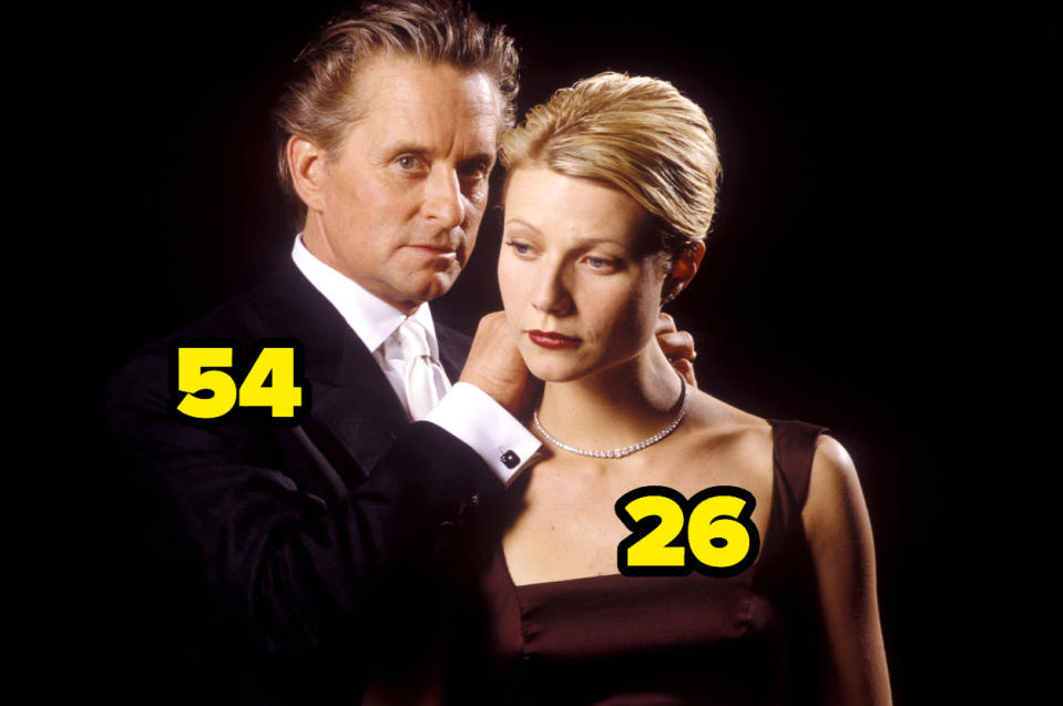 54-year-old Michael Douglas putting a necklace on 26-year-old Gwyneth Paltrow