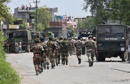 Indian army soldiers patrol near the site of a gunfight at Dinanagar town in Gurdaspur district of Punjab, India, July 27, 2015. REUTERS/Munish Sharma