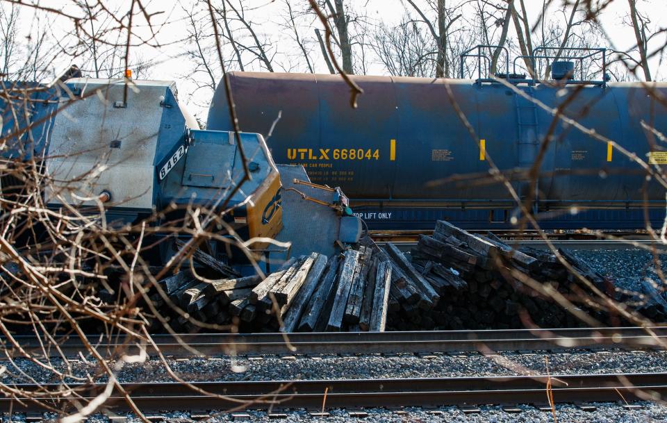 Work begins on a train derailment cleaned up Tuesday, Jan. 18, 2022, in Avon, Ind.