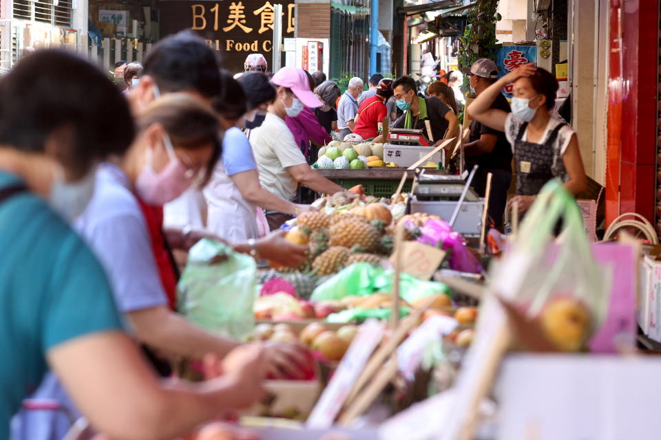 People wearing protective face masks shop at a market amid the coronavirus disease (COVID-19) pandemic, in Taipei, Taiwan, June 8, 2021. REUTERS/Ann Wang