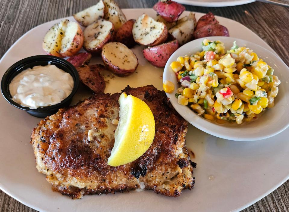 Citrus Grouper with red skin potatoes and corn salad at Dockside Waterfront Grill photographed Sept. 17, 2023.