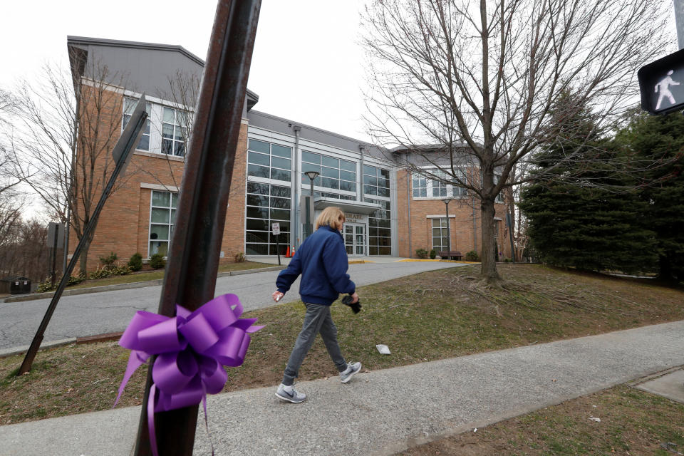 A woman walks past the Young Israel orthodox synagogue during the coronavirus outbreak in New Rochelle, New York, on March 12. (Photo: Shannon Stapleton / Reuters)