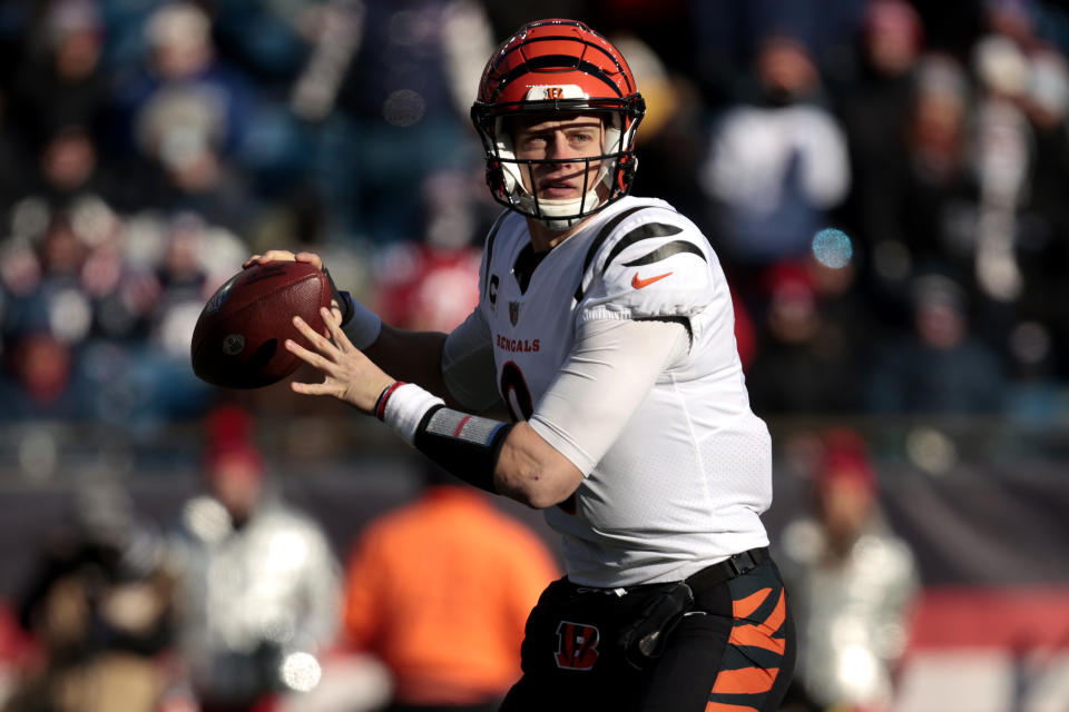 Joe Burrow #9 of the Cincinnati Bengals attempts a pass during the first quarter of an NFL game against the New England Patriots at Gillette Stadium 