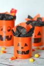 <p>Upcycled tin cans serve as the main ingredient for this simple craft project. Spray paint them orange, and color the faces with black permanent marker. Use any sizes you have on hand to make a big pumpkin family; fill this functional project with candy, school supplies, or anything else the kids can dream up.</p><p><em><a href="https://typicallysimple.com/tin-can-pumpkins-halloween-craft/" rel="nofollow noopener" target="_blank" data-ylk="slk:Get the tutorial at Typically Simple»;elm:context_link;itc:0;sec:content-canvas" class="link ">Get the tutorial at Typically Simple»</a></em></p>