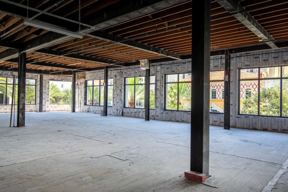 Interior of 111 Olive, a historic downtown West Palm Beach office building featuring original Dade County Pine in the ceiling.