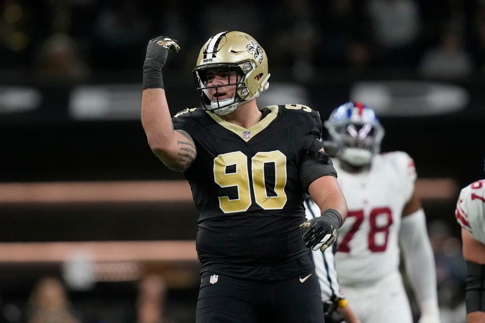 New Orleans Saints defensive tackle Bryan Bresee celebrates after sacking New York Giants quarterback Tommy DeVito for a 10-yard loss during the first half of an NFL football game Sunday, Dec. 17, 2023, in New Orleans. (AP Photo/Gerald Herbert)