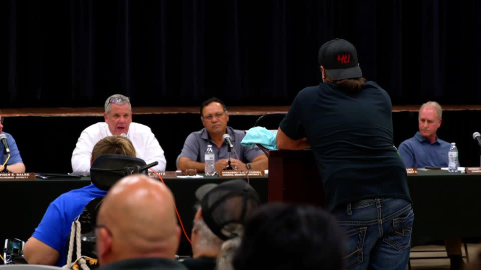Mayor Cody Smith, left, speaks during an Uvalde City Council meeting on March 12. - CNN