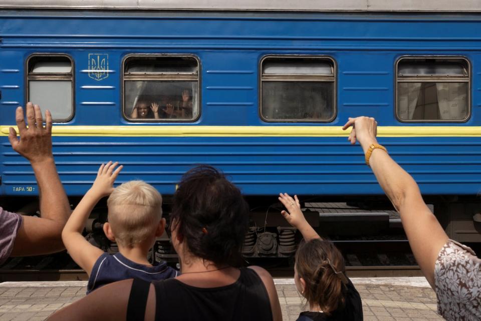 People bid farewell to relatives as they flee on an evacuation train from Russian troop advances in Pokrovsk, Ukraine, amid Russia's attack on Ukraine, August 22, 2024.  