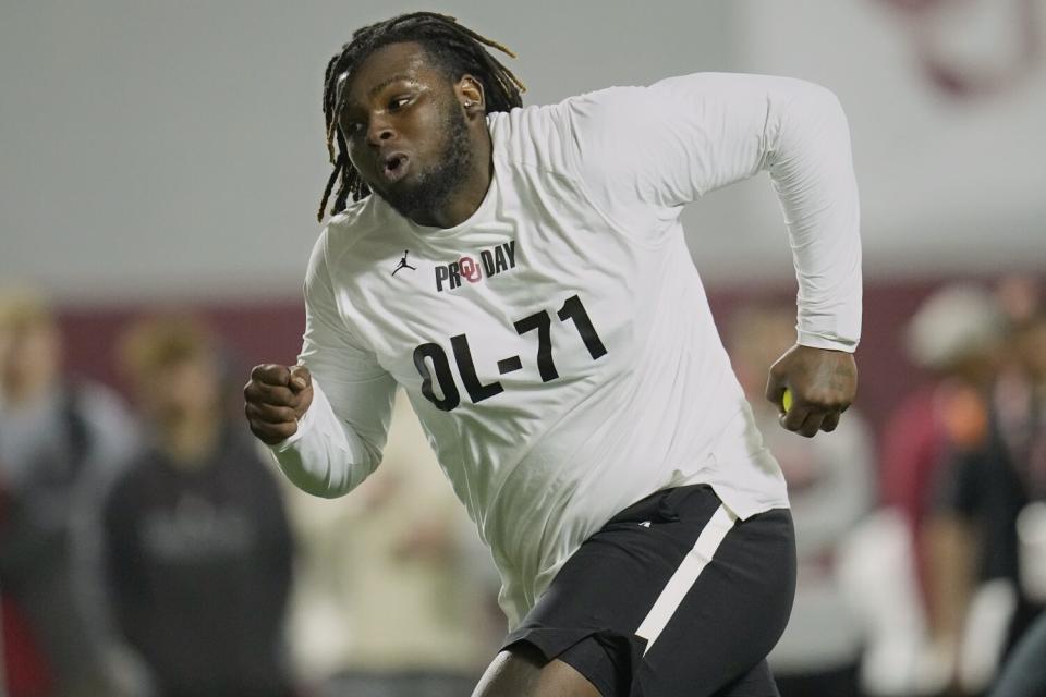 Oklahoma offensive lineman Anton Harrison participates in a drill during the Sooners' pro day on March 30.