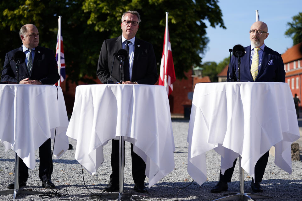 British Defence Secretary Ben Wallace, Danish Minister of Defence Morten Bodskov and Ukrainian Defence Minister Oleksii Reznikov, seen from left, hold a press conference about the support for Ukraine in Copenhagen, Wednesday Aug. 10, 2022. The upcoming international donation conference, which will take place in Copenhagen on Thursday August 11, 2022, will strengthen the long-term support for Ukraine with discussions on how financing, weapons production, training and demining can be strengthened going forward. (Martin Sylvest/Ritzau Scanpix via AP)