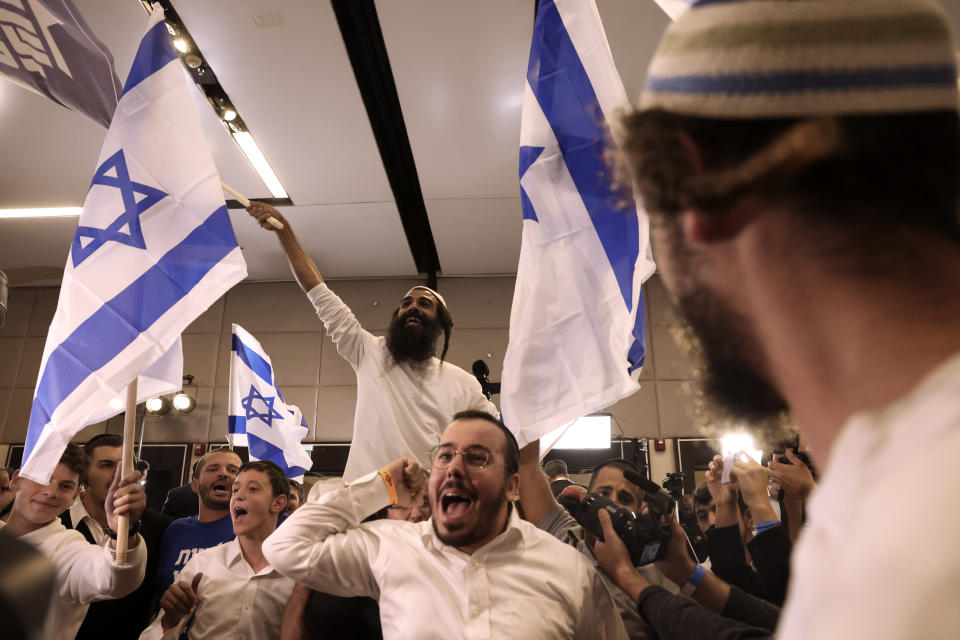 FILE - Supporters of Israeli far-right lawmaker and the head of "Jewish Power" party, Itamar Ben-Gvir, celebrates after first exit poll results for the Israeli Parliamentary election at the party's headquarters in Jerusalem, Tuesday, Nov. 1, 2022. News of the apparent comeback of former Prime Minister Benjamin Netanyahu and the dramatic rise of his far-right and ultra-Orthodox allies has elicited little more than a shrug among many Palestinians. (AP Photo/Oren Ziv, File)