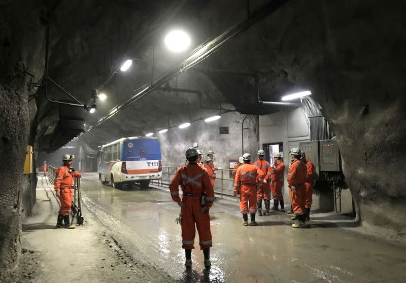 FILE PHOTO: Miners wait for transport inside the Codelco El Teniente copper mine, the world's largest underground copper mine near Machali, Chile