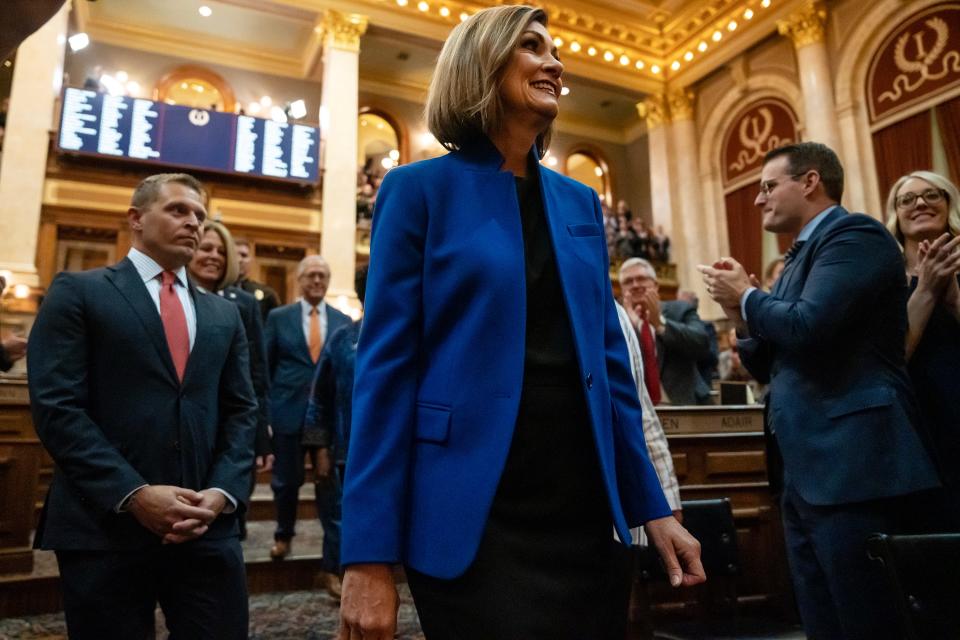 Gov. Kim Reynolds is escorted into the Iowa House of Representatives, on Tuesday evening, Jan. 10, 2023, to give the annual Condition of the State address, at the Iowa State Capitol, in Des Moines.