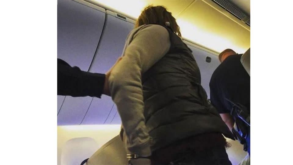 The woman was restrained when she allegedly tried to open an exit door during a flight to Boston. Photo: Instagram @themanship