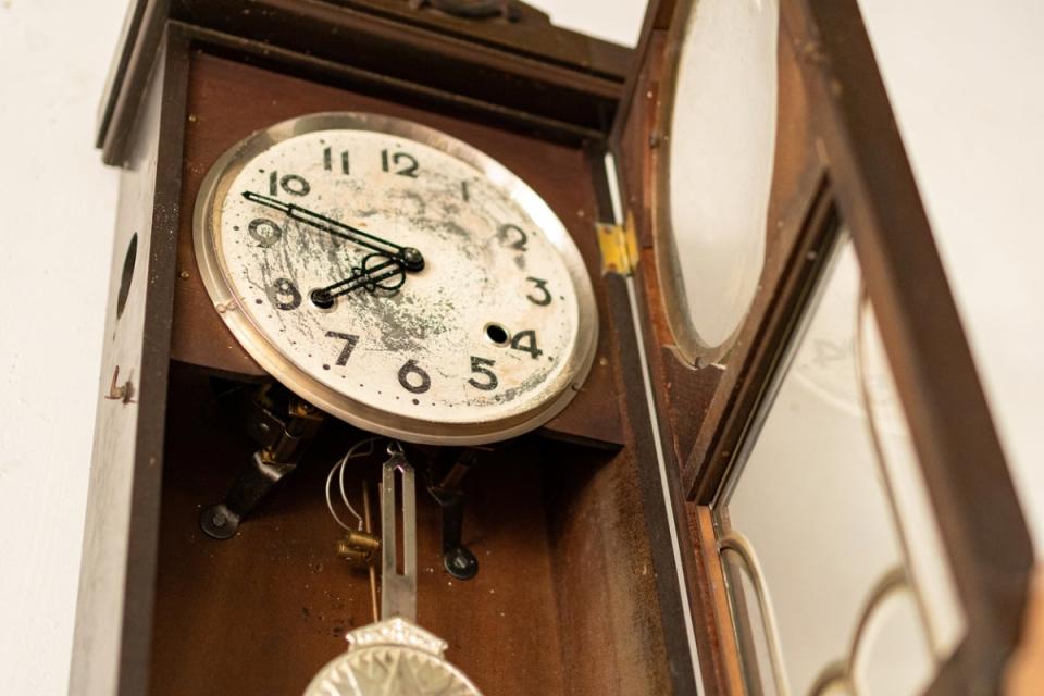 Antique grandfather clock with a broken face