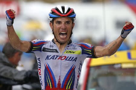 Katusha rider Joaquim Rodriguez of Spain celebrates as he crosses the finish line to win the 195-km (121.16 miles) 12th stage of the 102nd Tour de France cycling race from Lannemezan to Plateau de Beille, in the French Pyrenees mountains, France, July 16, 2015. REUTERS/Eric Gaillard