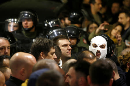 Protesters briefly broke into Serbia's state television building during a protest against Serbian President Aleksandar Vucic and his government in central Belgrade, Serbia, March 16 , 2019. REUTERS/Djordje Kojadinovic